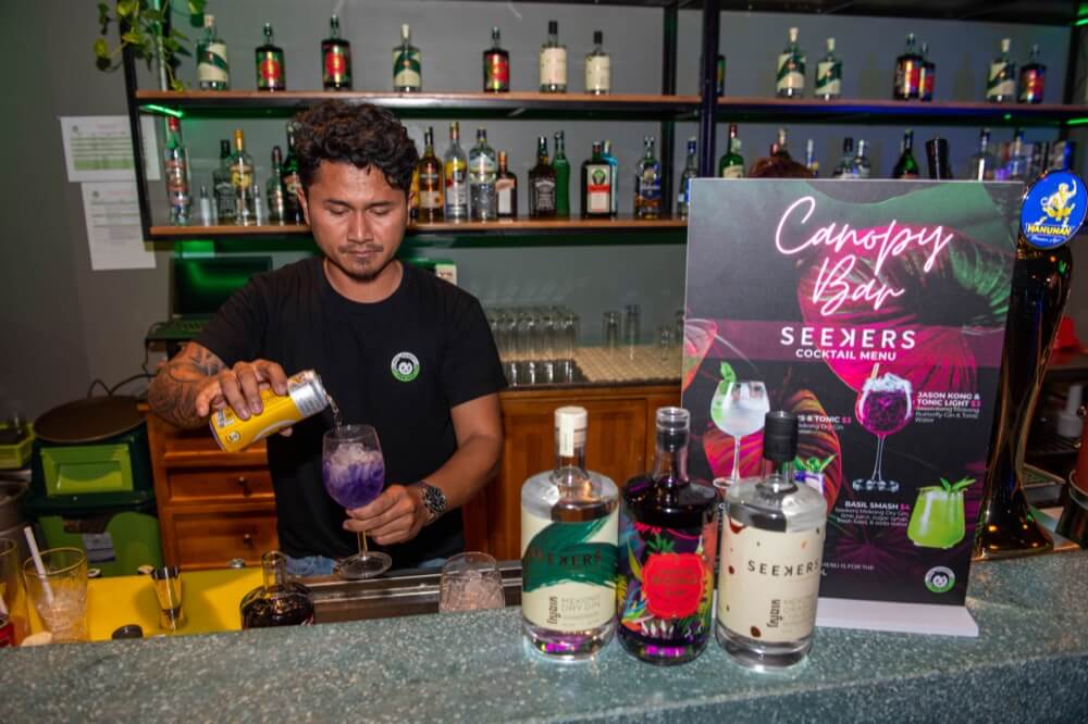 Bartender at Canopy Bar, Siem Reap pouring a cocktail