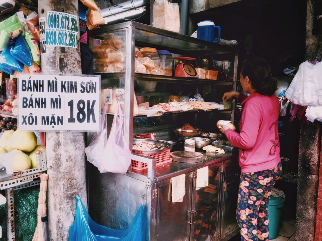 A Ban Mi seller on the streets of Vietnam