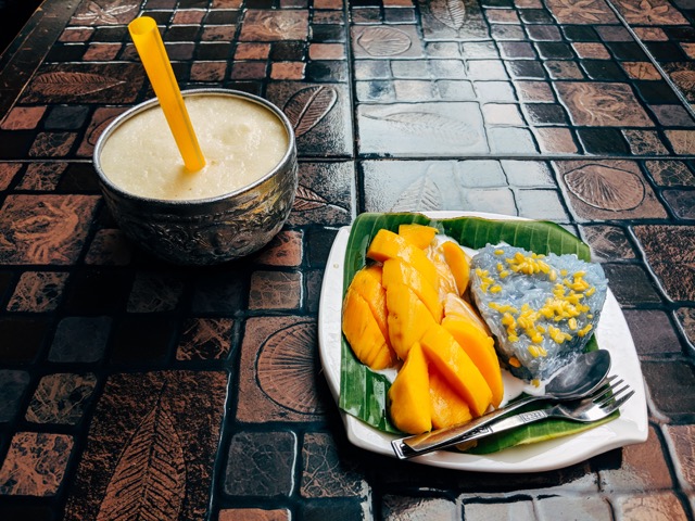 Mango sticky rice served with sweet coconut milk in Thailand