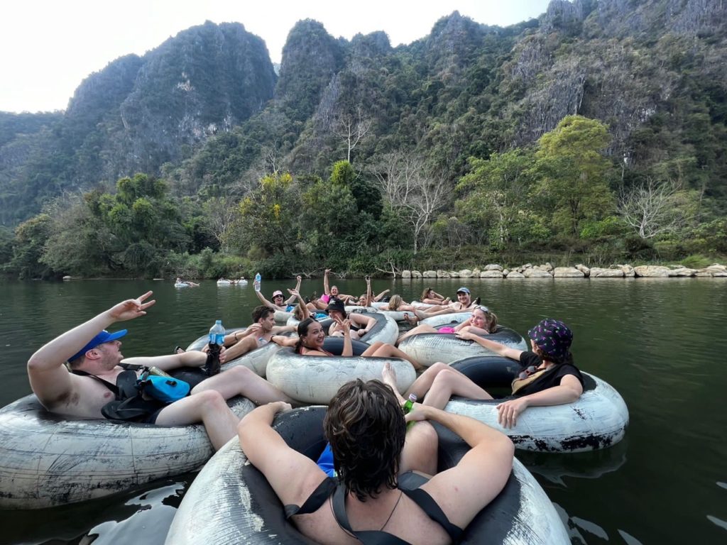 Mad Monkey Tour heads down stream of the Nam Song River in Vang Vieng, Laos